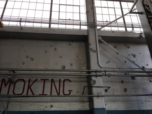 Hangar 11 when I worked there.  Bullet marks from the strafing.  I played basketball on a court there at work, beneath a B-18 hoist and instructions.
